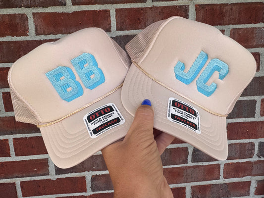 Cream + blue initial trucker