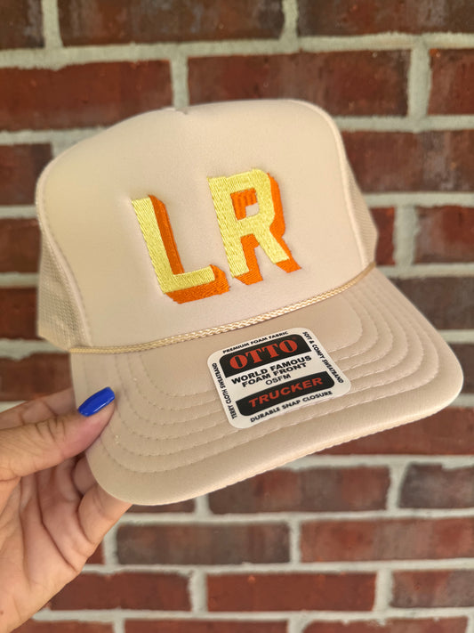 Cream + yellow + orange initial trucker
