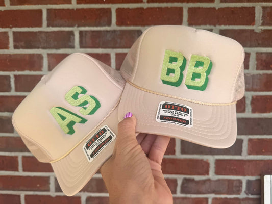 Cream + green initial trucker